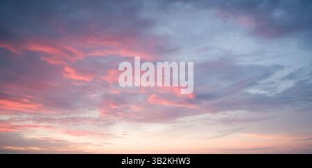 Pink Clouds at Sunset: Sky Beauty. Stock Photo