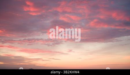 Pink Clouds at Sunset: Sky Beauty. Stock Photo