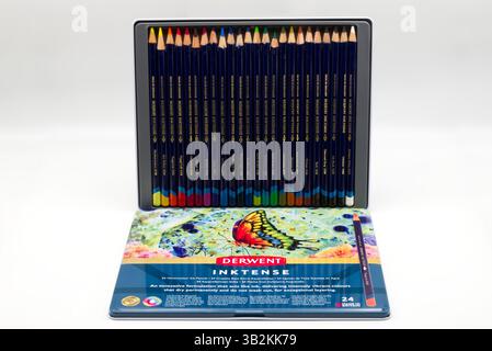 Derwent InkTense 24 Watercolor Pencils in a metal tin isolated on white. Stock Photo