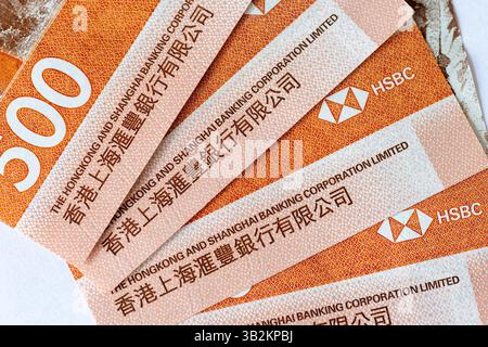 London. UK- 04.27.2025.The name and logo of The Hong Kong And Shanghai Banking Corporation Limited on Hong Kong dollar bank notes. Stock Photo