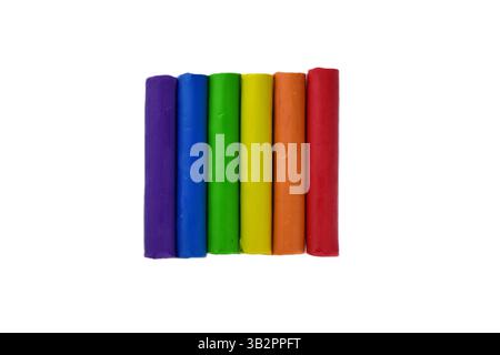Colorful clay sticks play dough plasticine vibrant colors in a row isolated background Stock Photo