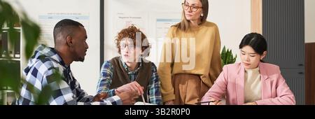 Studying Foreign Languages with Teacher in Classroom Setting Stock Photo