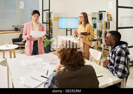 Studying Languages in Modern Classroom Setting Stock Photo