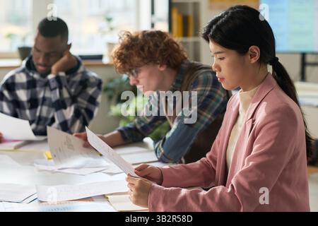Studying Foreign Languages in Classroom Setting Together Stock Photo