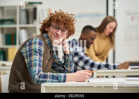 Studying Foreign Languages in Classroom with Focused Students Stock Photo