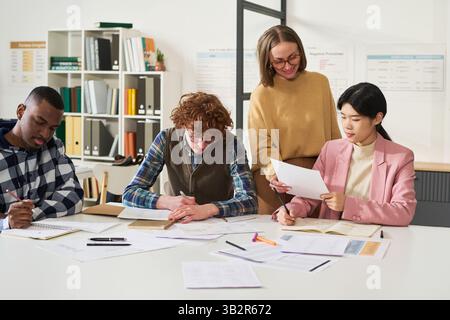 Studying Foreign Languages in Modern Classroom Setting Stock Photo