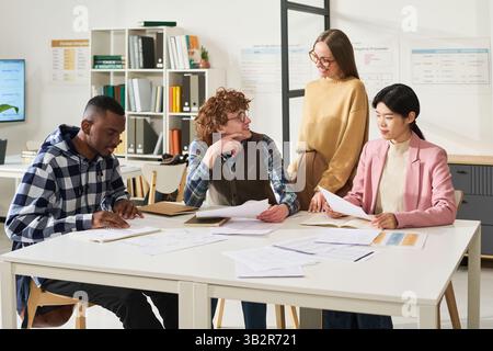 Diverse Group of Students Studying in Classroom Stock Photo