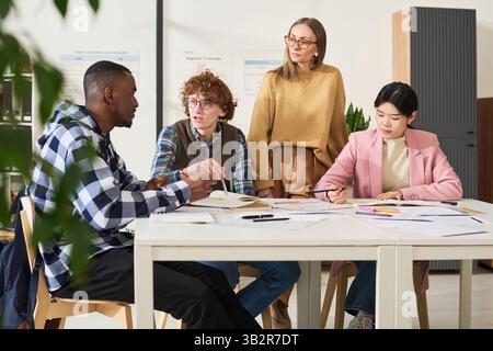 Studying Foreign Languages in Diverse Classroom Setting Stock Photo