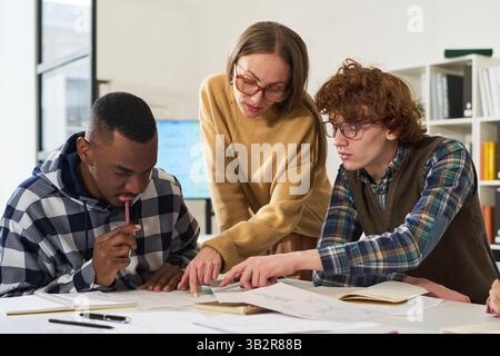 Teachers Assisting Multiracial Students Learning Foreign Languages Stock Photo