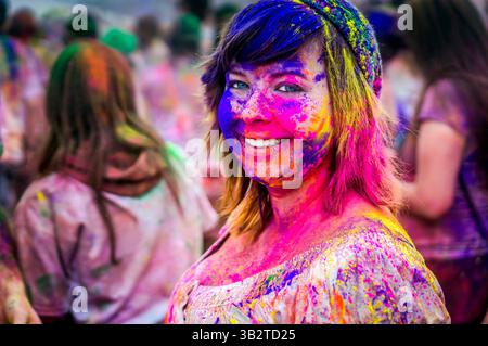 March 29, 2014 - Spanish Fork, UT, United States of America - A young woman covered in colored powder during the Holi Festival of Colors at the Sri Sri Radha Krishna Temple March 29, 2014 in Spanish Fork, Utah. The festival follows the Indian tradition of Holi and attracts over 80,000 people. (Credit Image: © Steven Gerner/Planet Pix via ZUMA Wire) Stock Photo
