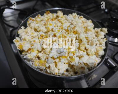 Freshly popped popcorn on the stovetop Stock Photo