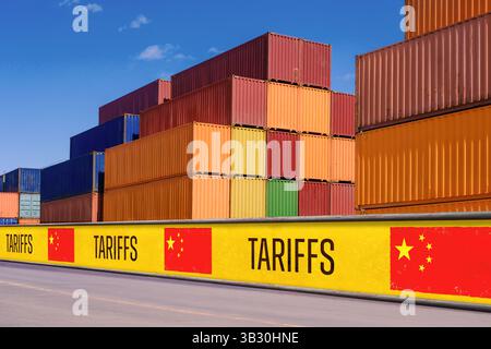 Stacked shipping containers behind tariff barriers with US flags ...