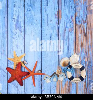 Beach poster on wooden background with starfishes and cabins Stock Photo