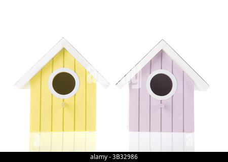 Many colorful bird boxes isolated over white background Stock Photo