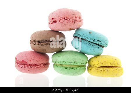 Colorful stacked French macaroons isolated over white background Stock Photo
