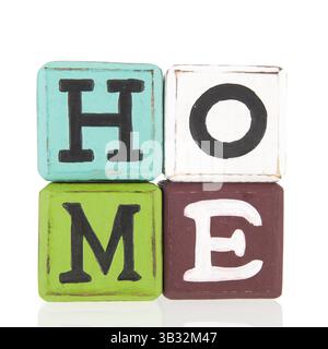 Colorful wooden blocks with home text isolated over white background Stock Photo