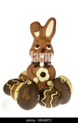 Chocolate easter bunny with eggs on white background Stock Photo