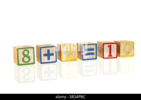 Colorful educational wooden toy blocks with sum Stock Photo