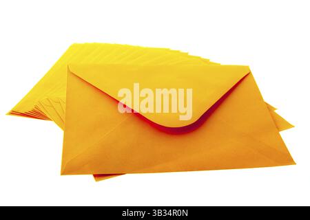 Stacked orange envelopes isolated over white background Stock Photo