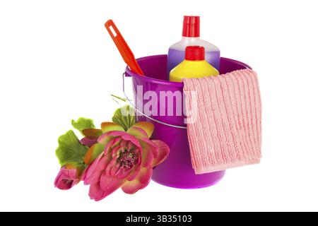 Violet plastic bucket with liquid bottles cloth and brush Stock Photo