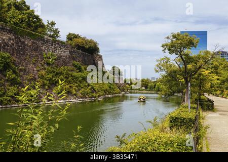 OSAKA, JAPAN - SEPTEMBER 25 2024: The iconic Osaka Castle and surrounding moat and gardens on a warm clear autumn day in Osaka, Japan on September 25t Stock Photo