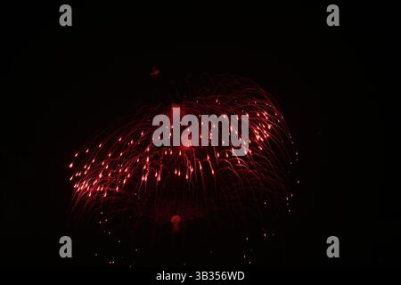 A fireworks display. Aerial colour fireworks in the night sky. Stock Photo