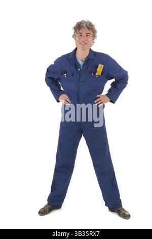 Handsome handyman in blue overall ready for the job Stock Photo