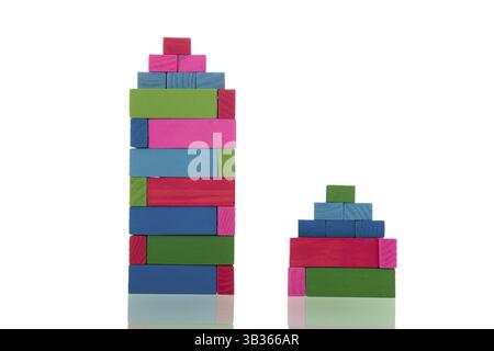 Colorful build houses with wooden blocks isolated over white background ...