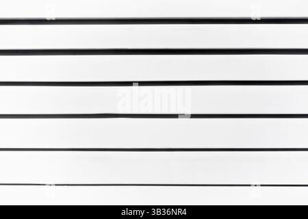 White covered blinds with black shadows, close-up. Stock Photo