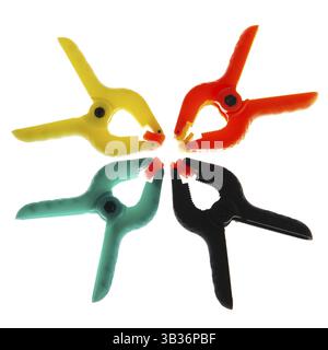 Four plastic clamps isolated over white background Stock Photo
