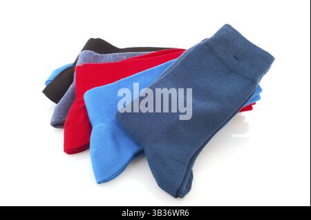 Colorful socks stacked and isolated on white background Stock Photo