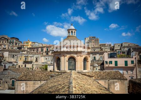 Detail of the Duomo di San Giorgio Modica, Sicily, Italy, seen from the bell tower and the town behind, a UNESCO World Heritage Site Stock Photo