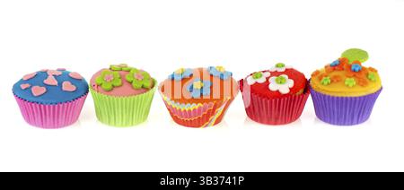 Row with five colorful different cupcakes Stock Photo
