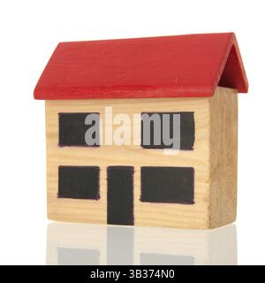 Miniature wooden house isolated against white background Stock Photo ...