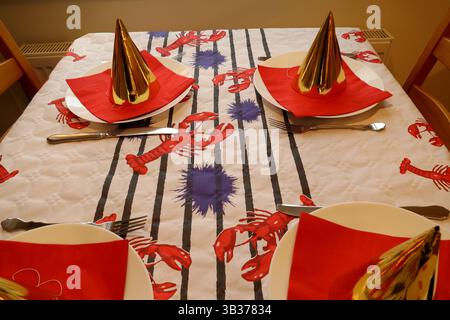 Crawfish party. Crayfish at transparent plate. Popular Swedish tradition in August or September. White paper with symbols of cray fish on. Sweden. Stock Photo