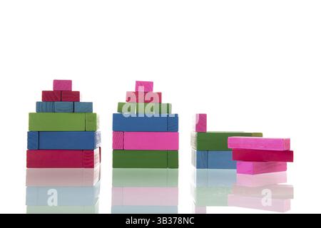 Colorful build houses with wooden blocks isolated over white background Stock Photo
