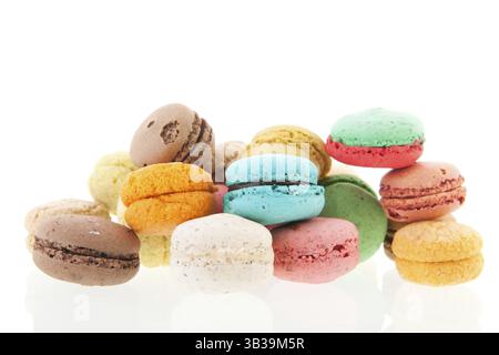 Colorful stacked French macaroons isolated over white background Stock Photo