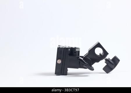 flash holder tripod mount for external flash and white umbrella for studio shooting Stock Photo