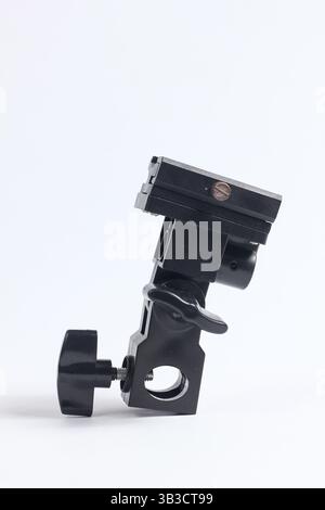 flash holder tripod mount for external flash and white umbrella for studio shooting Stock Photo