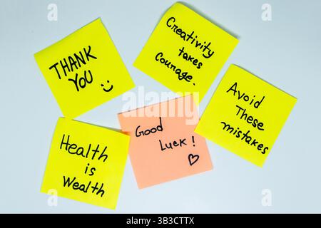 Positive affirmations concept. Phrases of different colors sheets for notes on a green background. Motivational concept with handwritten text. Stock Photo