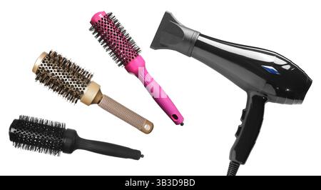 Hair dryer and round brushes in air on white background, collage Stock Photo