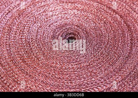 Copper mesh, twisted into a roll, top view. Stock Photo