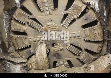 Tunnel Boring Machine front head element is seen on a subway station under construction Stock Photo