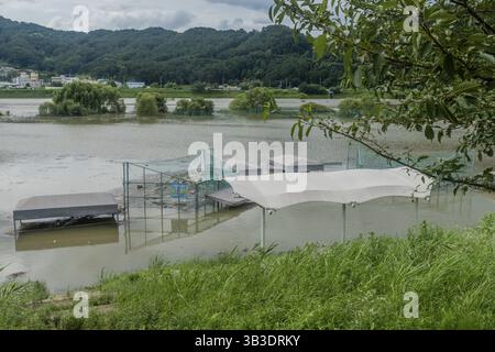 Daejeon, South Korea, August 9, 2020: Baseball diamond submerged in flooded river after torrential monsoon rainfall, Asia Stock Photo