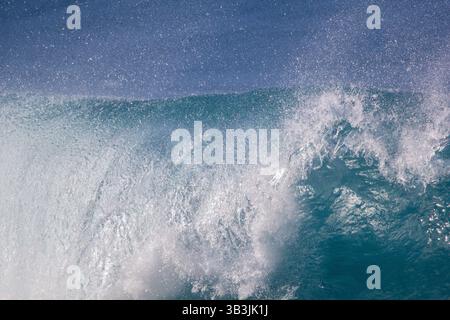 Crushing surf waves in turquoise blue coloured water close up Stock Photo