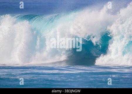 Crushing surf waves in turquoise blue coloured water close up Stock Photo