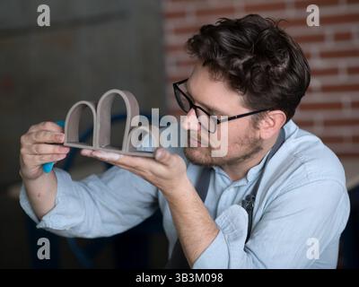 Ceramic artists working in pottery studio Stock Photo