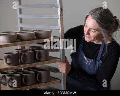 Ceramic artists working in pottery studio Stock Photo
