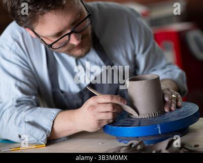 Ceramic artists working in pottery studio Stock Photo