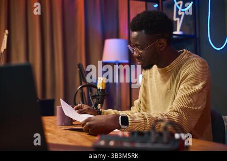 Man Reading Script Before Interview Stock Photo